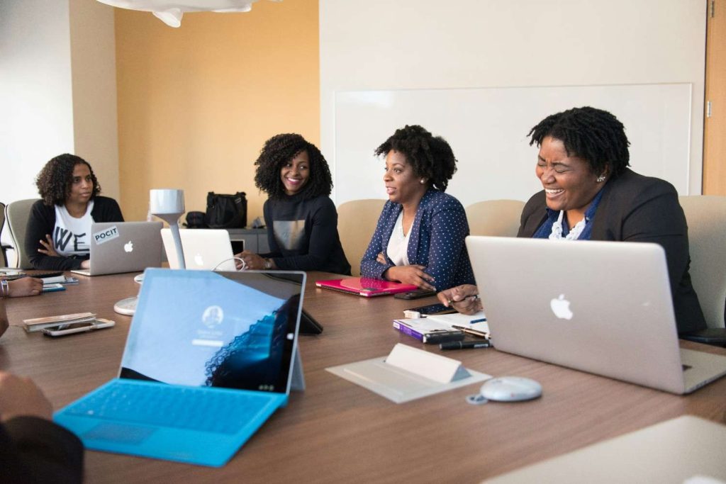 Group of African youth entrepreneurs collaborating in shared workspace