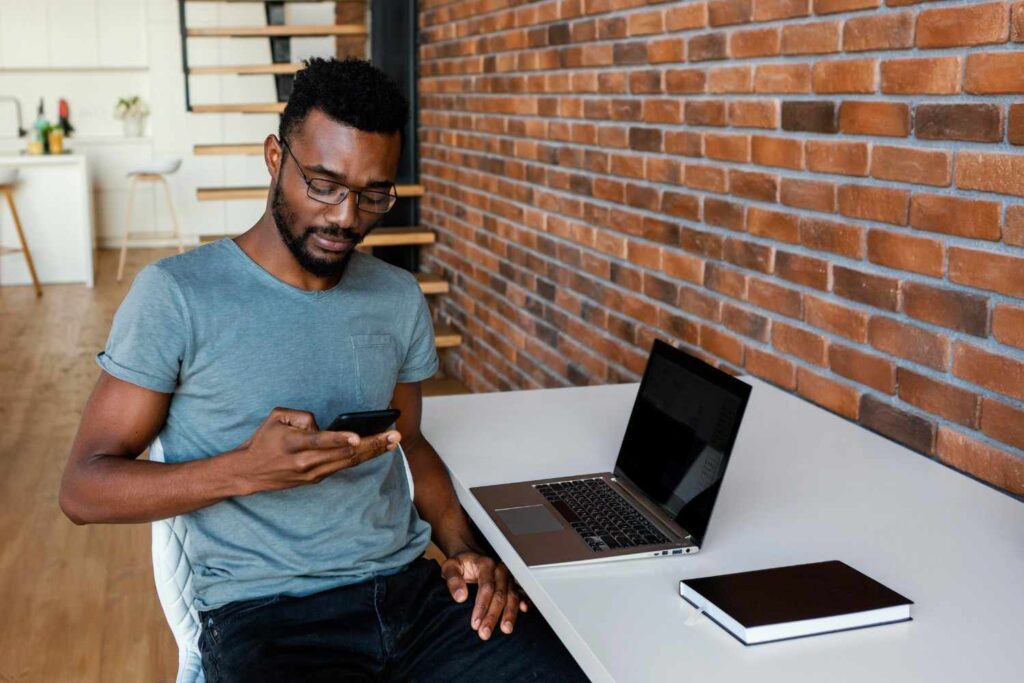 Young Nigerian entrepreneur planning a business in a small office setting
