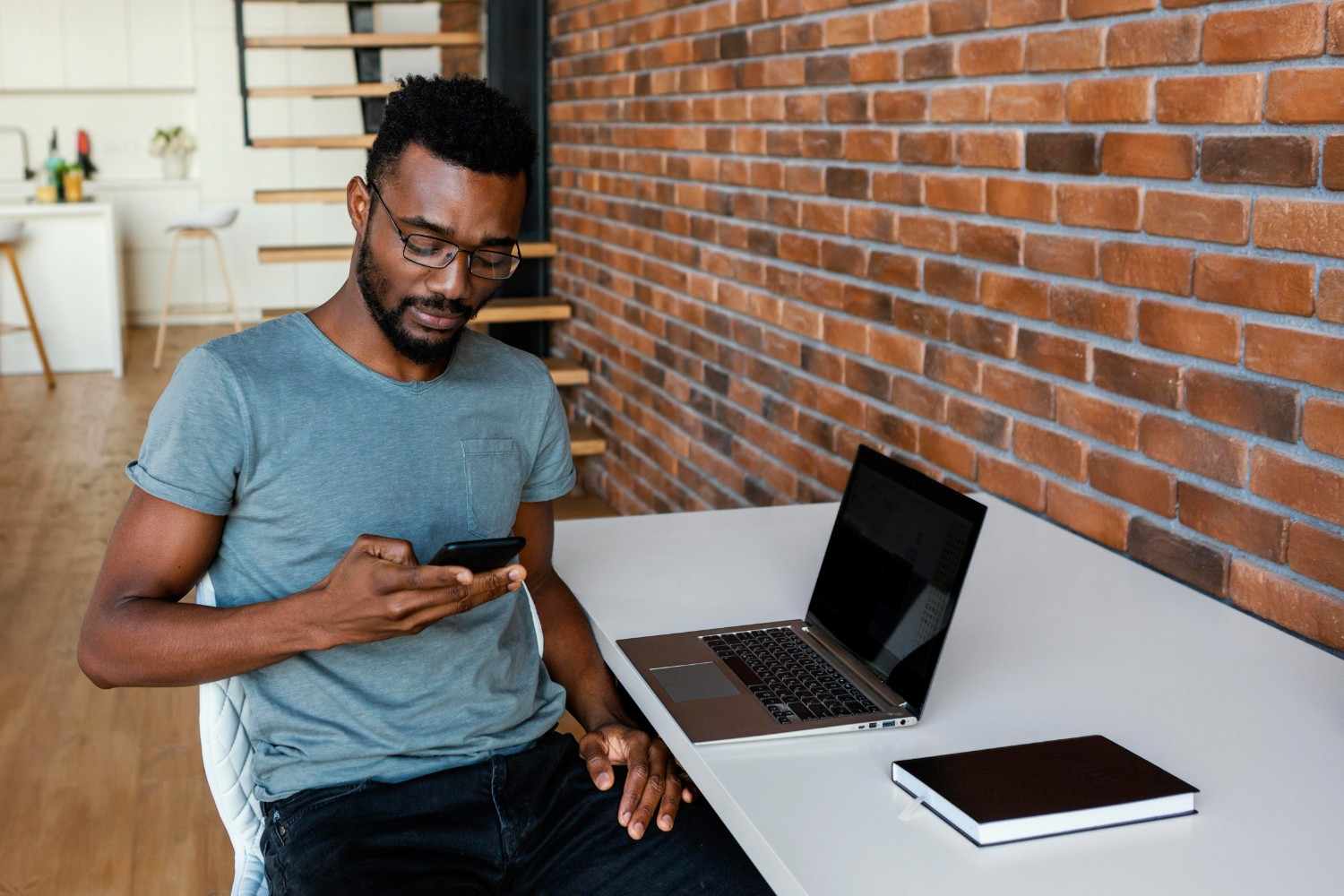 Young Nigerian entrepreneur planning a business in a small office setting