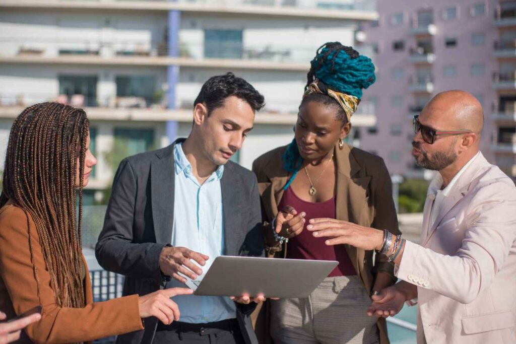 young founders networking with potential investors at a stylish co-working space (youth funding)